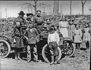 Jessie Field and students in red brush runabout.